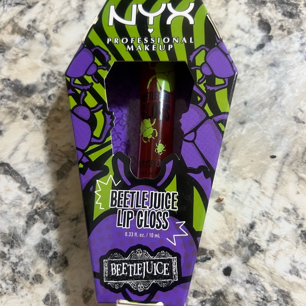 NYX X BEETLEJUICE POMEGRANATE CLOUT LOP GLOSS 0.33fl oz